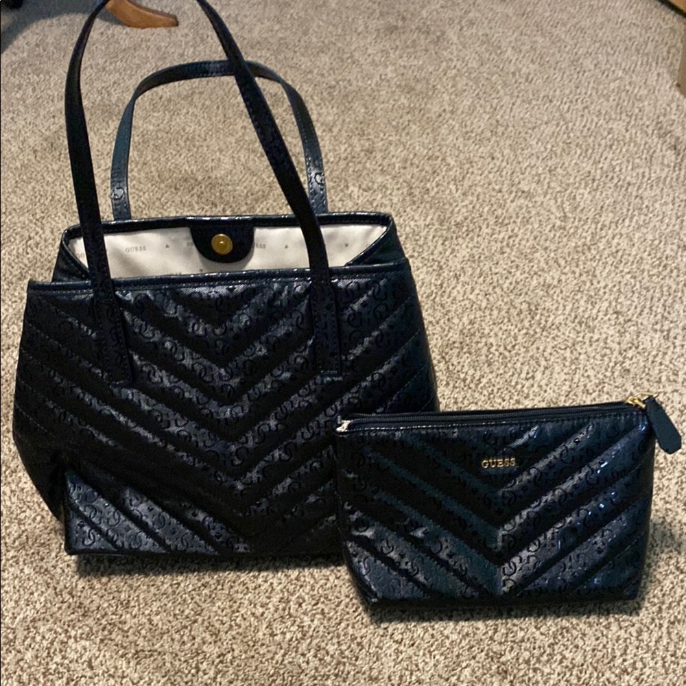 Guess shoulder bag with matching pouch .